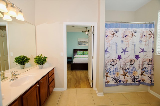 bathroom featuring vanity, tile patterned flooring, and shower / bathtub combination with curtain