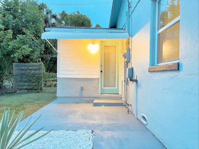 doorway to property featuring a patio