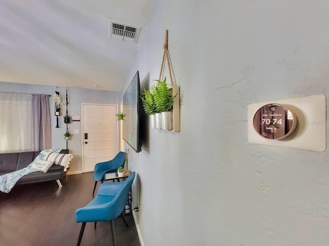 hallway with hardwood / wood-style flooring