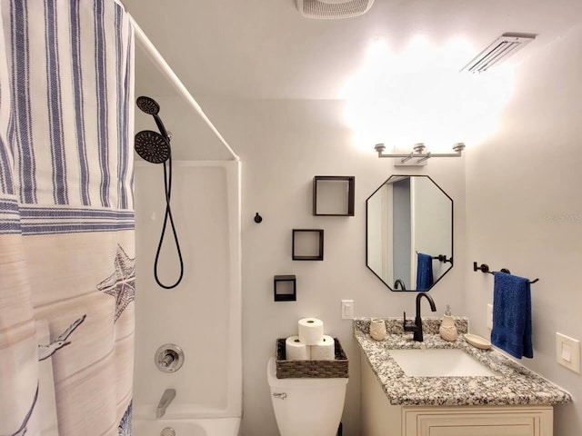 full bathroom featuring vanity, tub / shower combination, and toilet