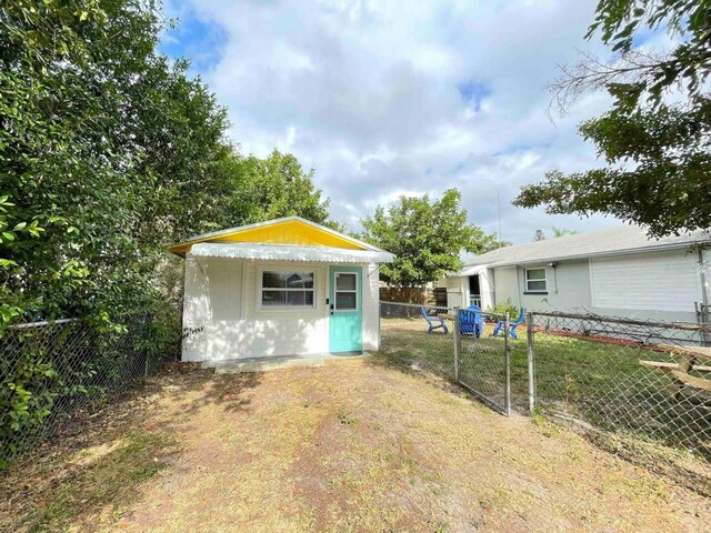 view of outbuilding featuring a lawn