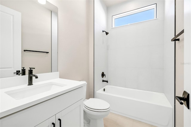 full bathroom featuring vanity, toilet, tile patterned floors, and tiled shower / bath combo