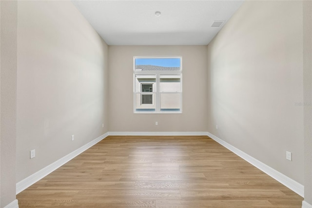 empty room with light wood-type flooring