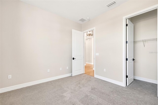 815 Liliana Dr, Deland, FL 32724 - unfurnished bedroom featuring carpet flooring, baseboards, and a closet