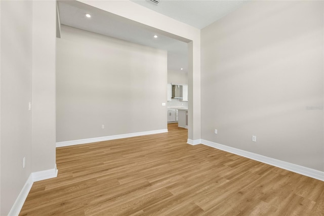 empty room with light hardwood / wood-style floors