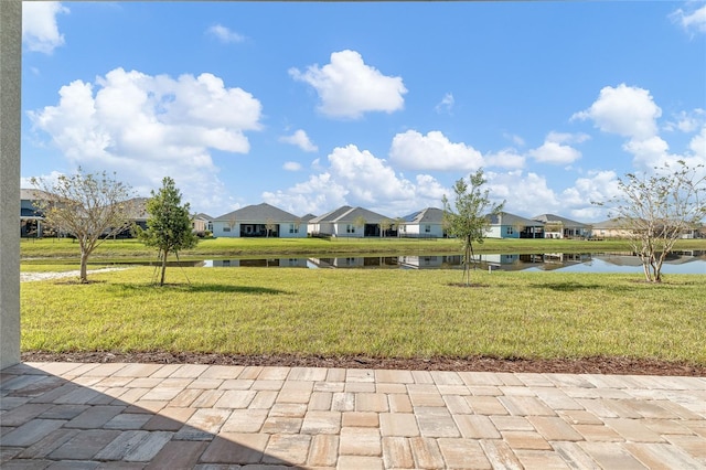 exterior space with a yard and a water view