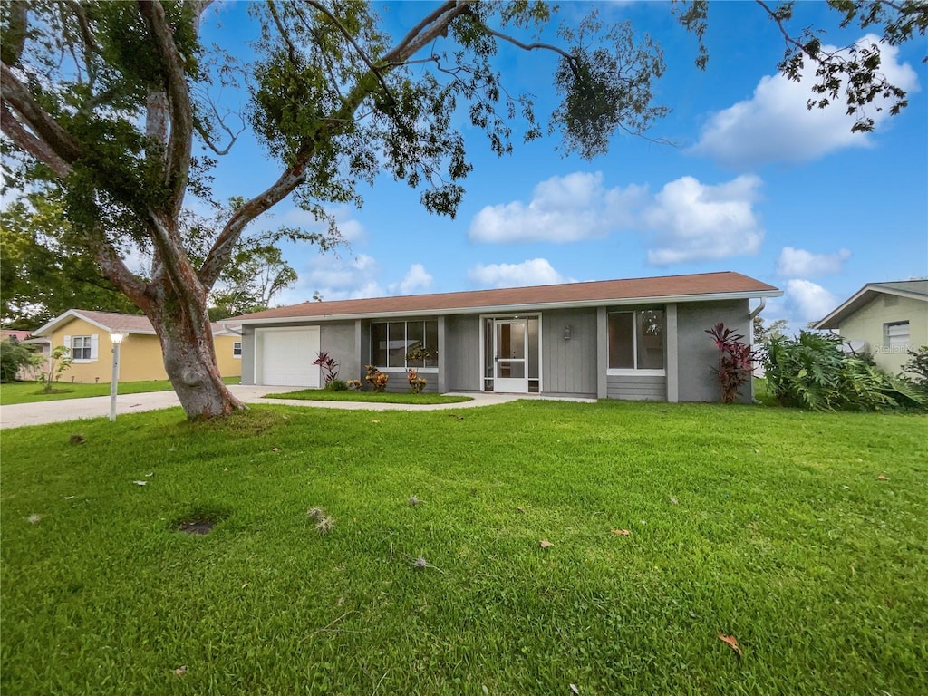 ranch-style house with a front lawn and a garage