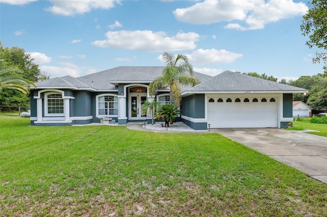 single story home with a front yard and a garage