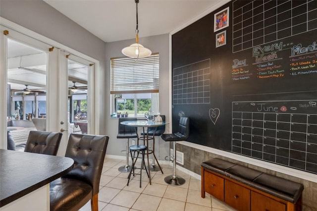 living room with ceiling fan, light tile patterned flooring, and french doors