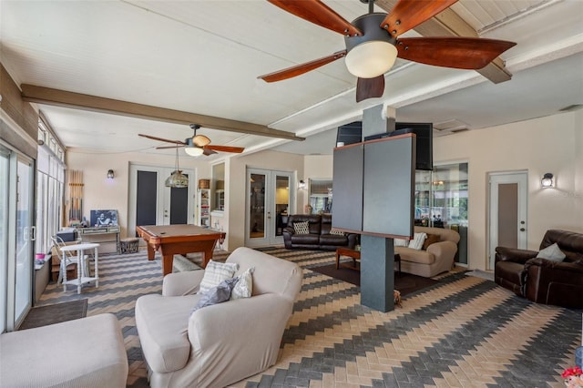 living room with beam ceiling, ceiling fan, pool table, and french doors