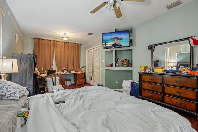 bedroom featuring ceiling fan and a closet