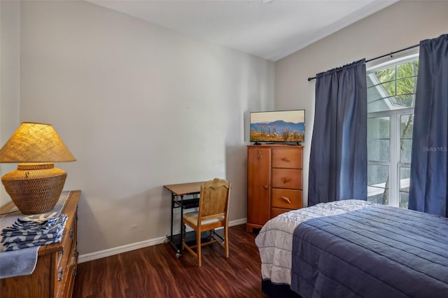 bedroom with dark wood-type flooring