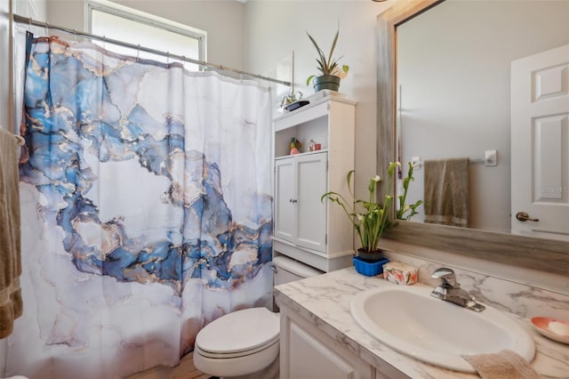 full bathroom with toilet, vanity, and shower / bath combo with shower curtain