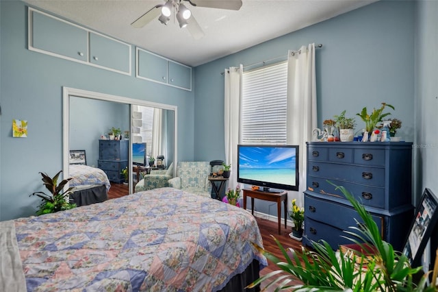 bedroom with ceiling fan and hardwood / wood-style flooring