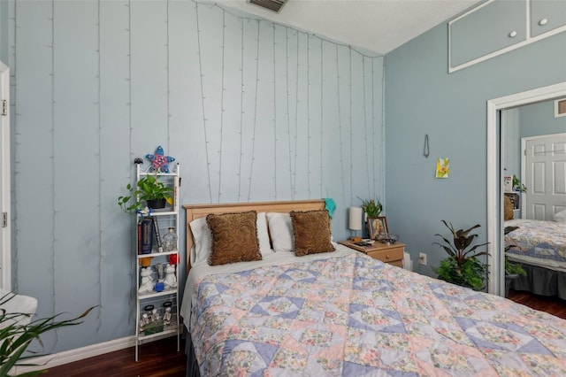 bedroom featuring dark hardwood / wood-style flooring