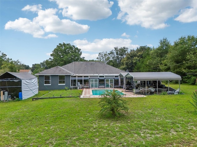 rear view of house featuring a patio area and a yard