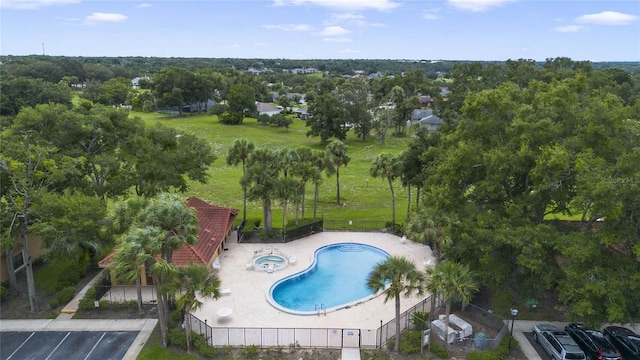 view of swimming pool featuring a lawn and a patio