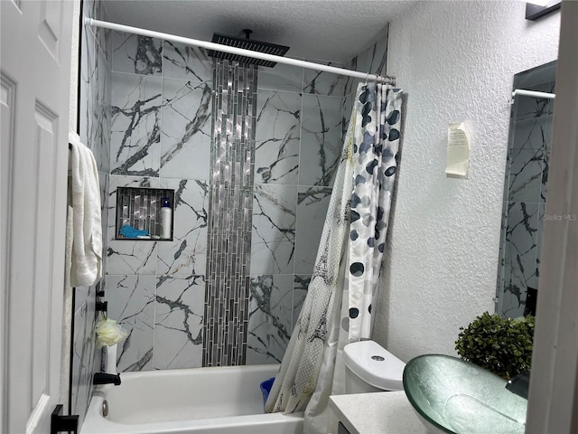 full bathroom with shower / bath combination with curtain, a textured wall, a textured ceiling, and vanity