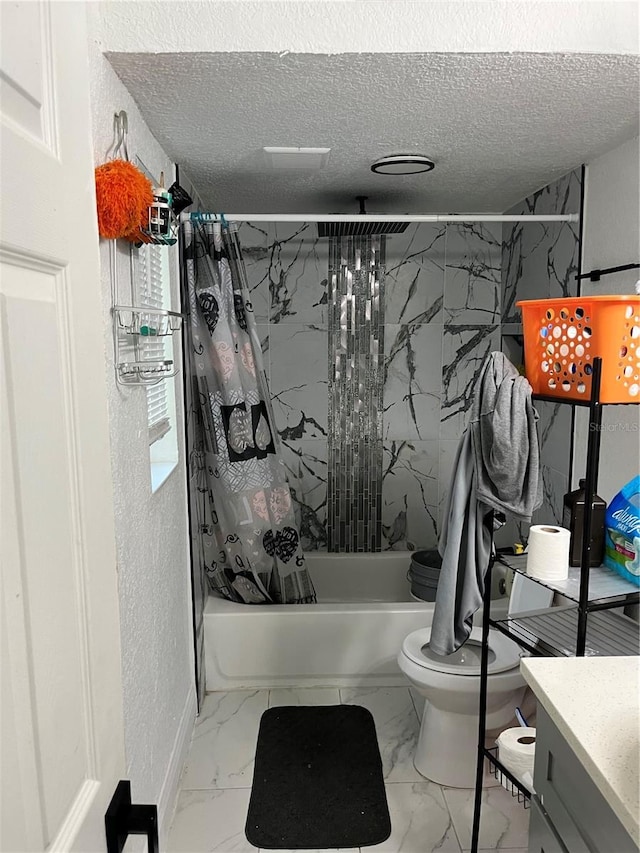 full bathroom with toilet, marble finish floor, shower / bathtub combination with curtain, a textured ceiling, and vanity