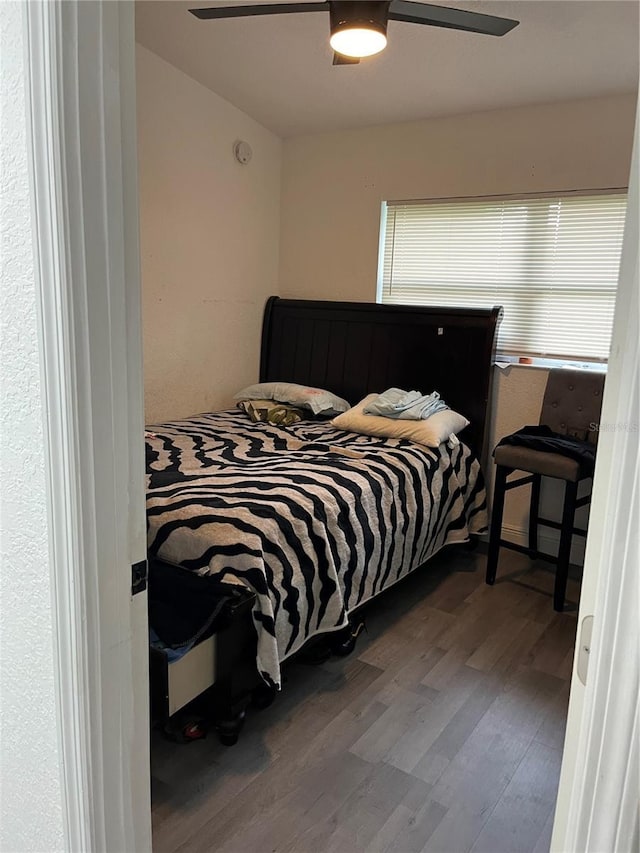 bedroom featuring ceiling fan and wood finished floors