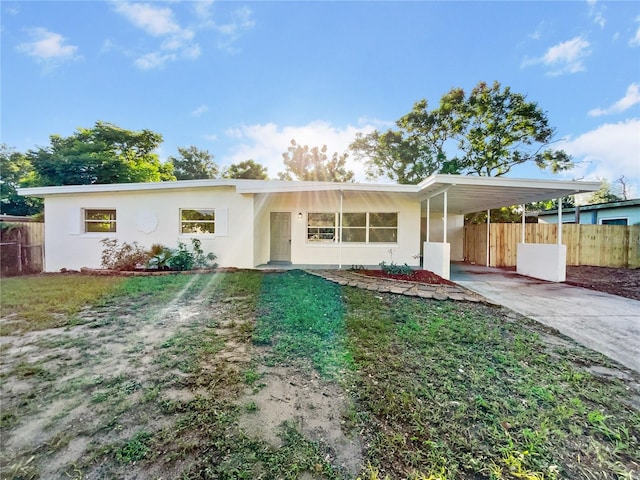 view of front of property featuring a carport