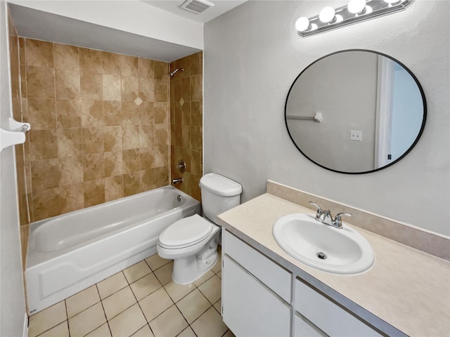 full bathroom featuring vanity, tiled shower / bath combo, toilet, and tile patterned floors