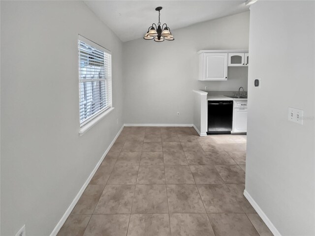 interior space with sink, lofted ceiling, and light tile patterned floors