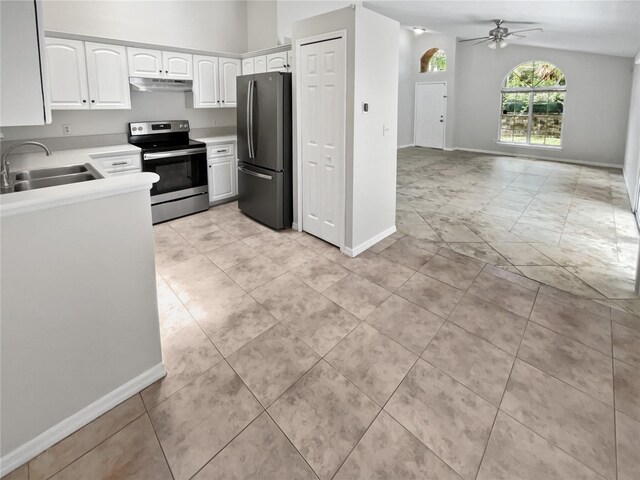 kitchen featuring light tile patterned flooring, white cabinets, ceiling fan, stainless steel appliances, and sink