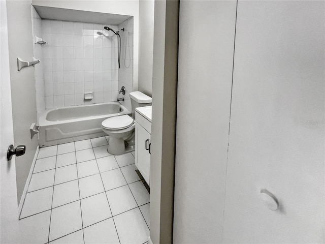 full bathroom with tile patterned floors, toilet, vanity, and tiled shower / bath