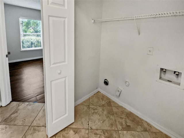 washroom with hookup for a gas dryer, hookup for a washing machine, and wood-type flooring