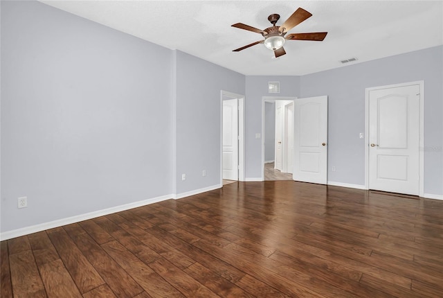 interior space featuring ceiling fan and dark wood-type flooring