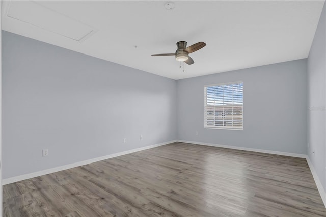 spare room featuring ceiling fan and light hardwood / wood-style floors