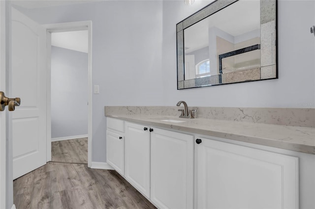 bathroom with wood-type flooring and vanity