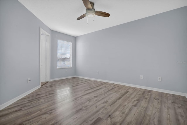 spare room featuring ceiling fan and wood-type flooring