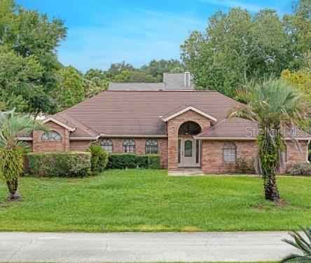 ranch-style house with a front yard