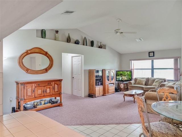 living room with light carpet, ceiling fan, and high vaulted ceiling