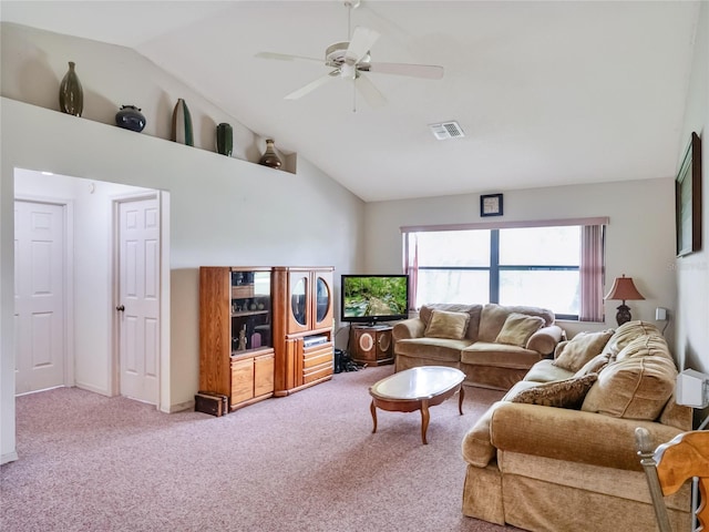 living room featuring carpet, ceiling fan, and vaulted ceiling