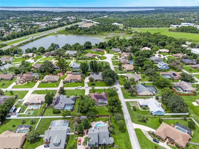 birds eye view of property featuring a water view