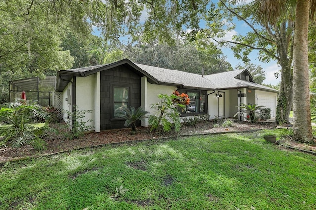 view of front facade with a garage and a front yard