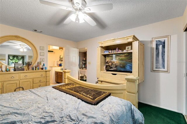 carpeted bedroom with ceiling fan and a textured ceiling