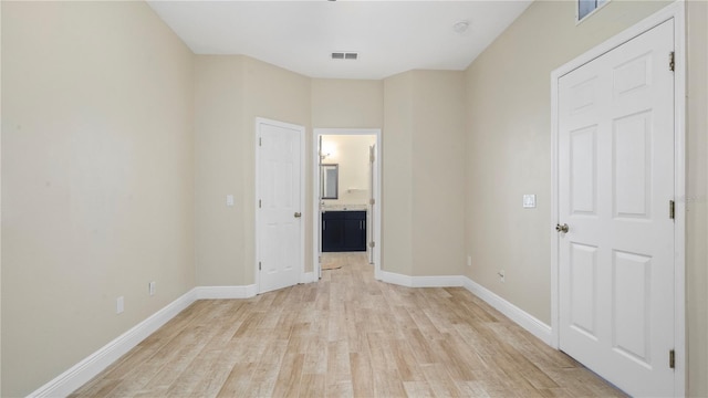 spare room featuring light wood-type flooring