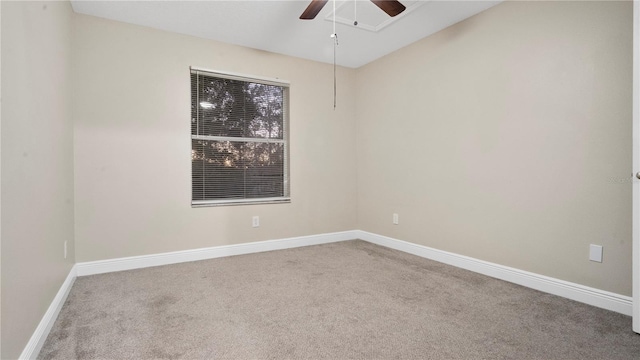 carpeted empty room featuring ceiling fan