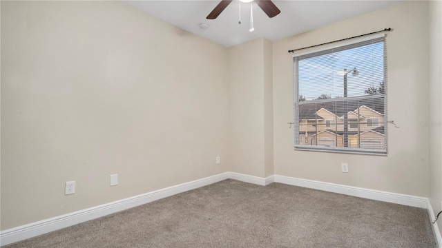 unfurnished room featuring ceiling fan and light colored carpet