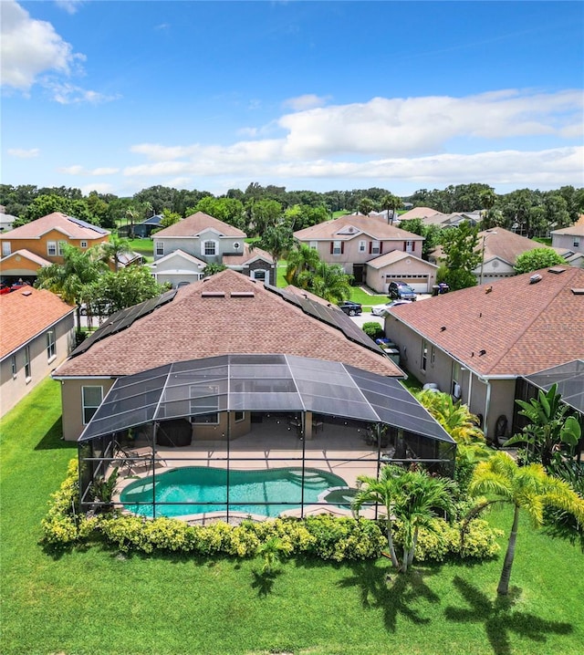 view of pool featuring a lawn