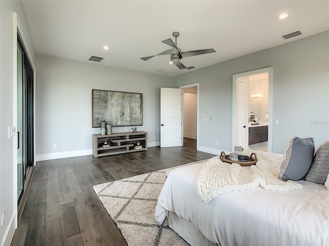 bedroom with ensuite bath, ceiling fan, and dark hardwood / wood-style floors