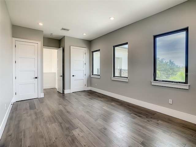 unfurnished bedroom featuring wood-type flooring