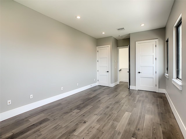 unfurnished bedroom featuring hardwood / wood-style floors