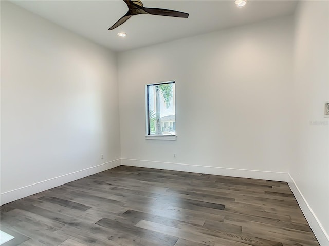 unfurnished room with ceiling fan and hardwood / wood-style flooring