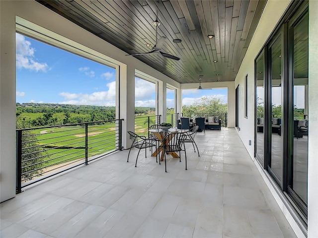 sunroom / solarium with wood ceiling