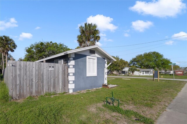 view of property exterior featuring a lawn